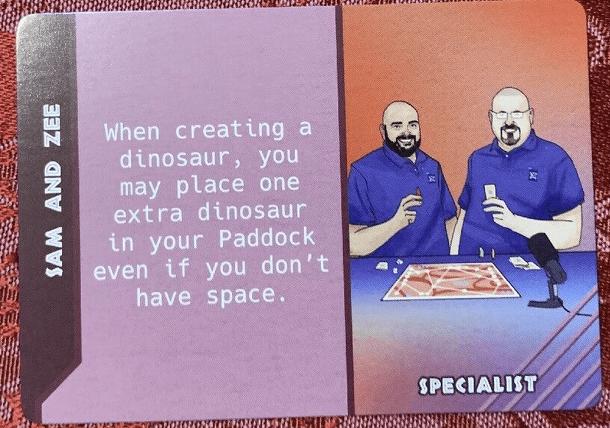 Dinosaur Island:  Dice Tower – Sam and Zee Promo Card